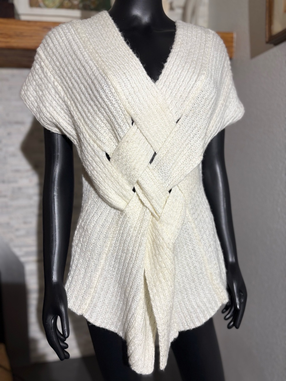 Escio knit sweater vest features a distinctive woven front design